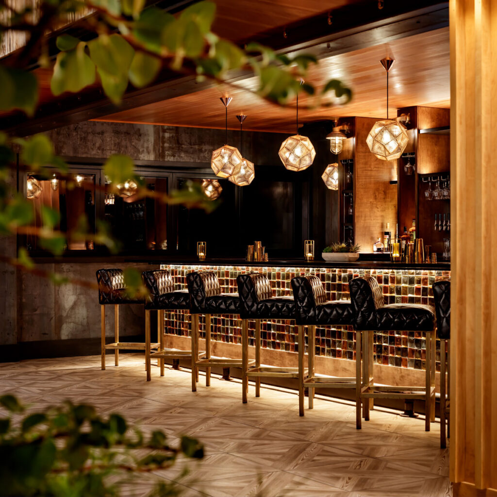 Rooftop lounge bar with globe pendants at KANÙ, Old Town Maine