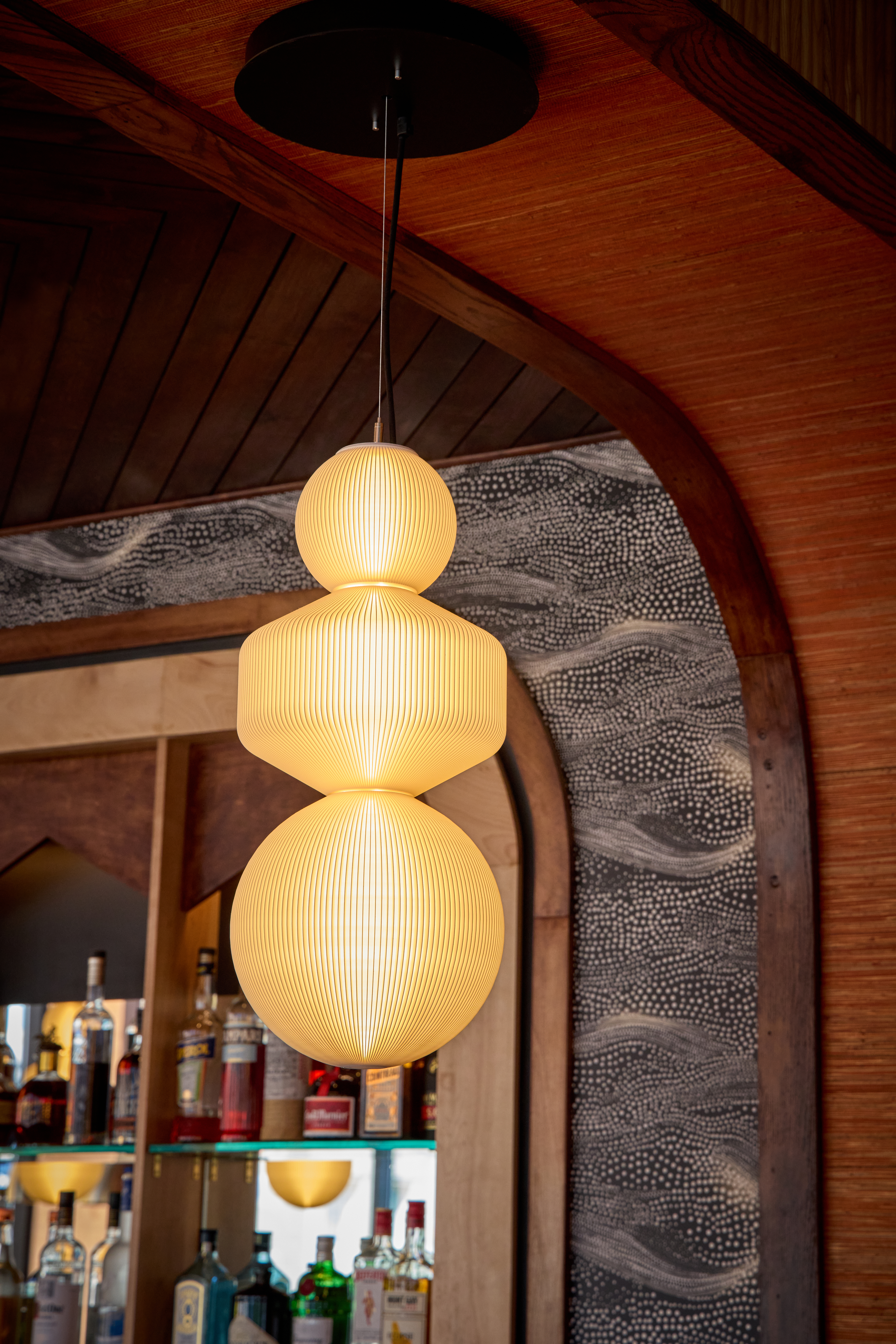 LightArt Sori stack pendant fixtures over the dining room at Rasa